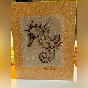 Hand painted seahorse on fabric greeting card.